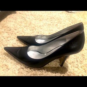 Pointed black high heels
